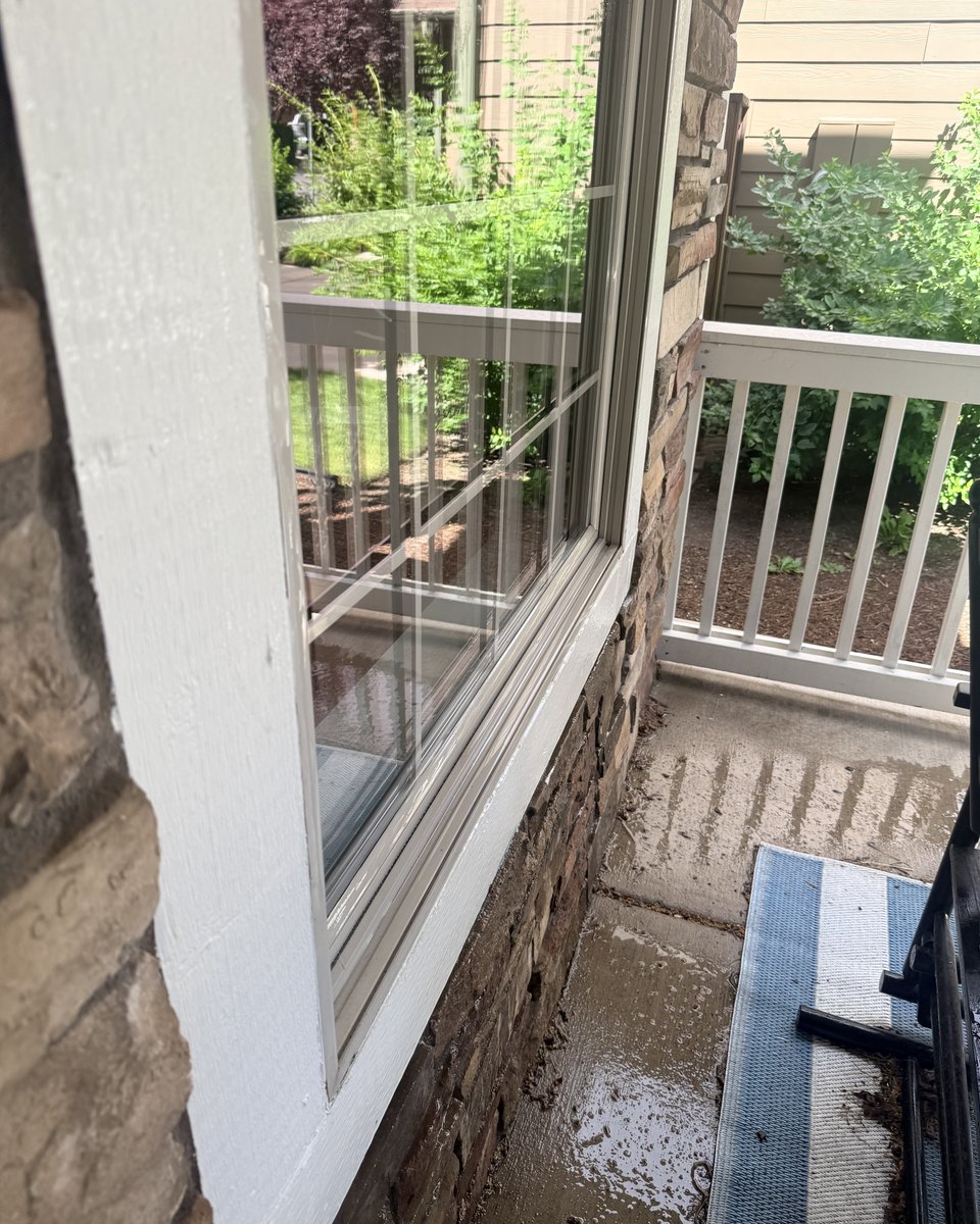 Same residential window sill after cleaning, bright white and spotless